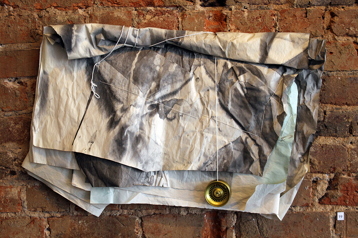 Yo , Harriet Hoover & Amy S. Hoppe, 2015, ink, acrylic spary paint, packing paper, string, and yo-yo
