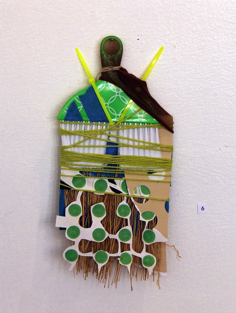 Under the Rug, Harriet Hoover & Amy S. Hoppe, 2015, plastic, nylon, straw, ink and paper
