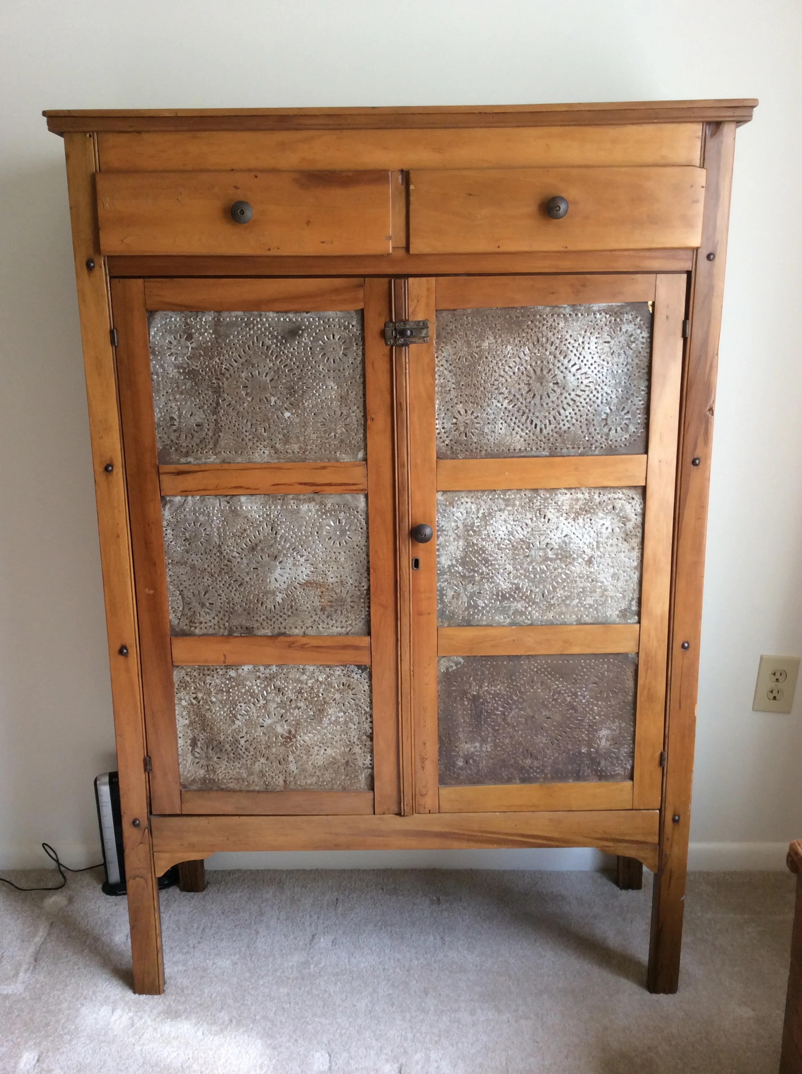 Poplar pie safe with perforated tin, circa 1900, originally painted, clear finish, interior shelves. $800 estimated value