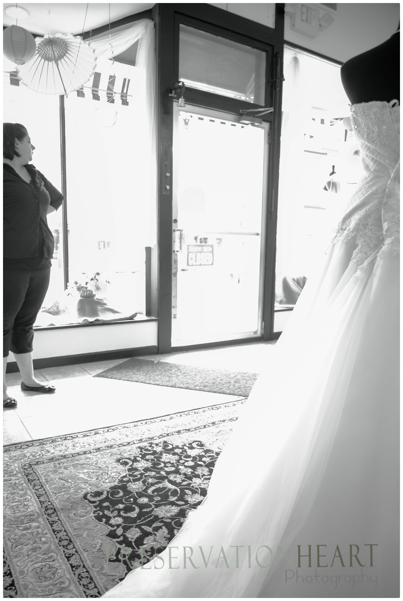 Marissa studies the display windows, she is the creative behind the shop design 