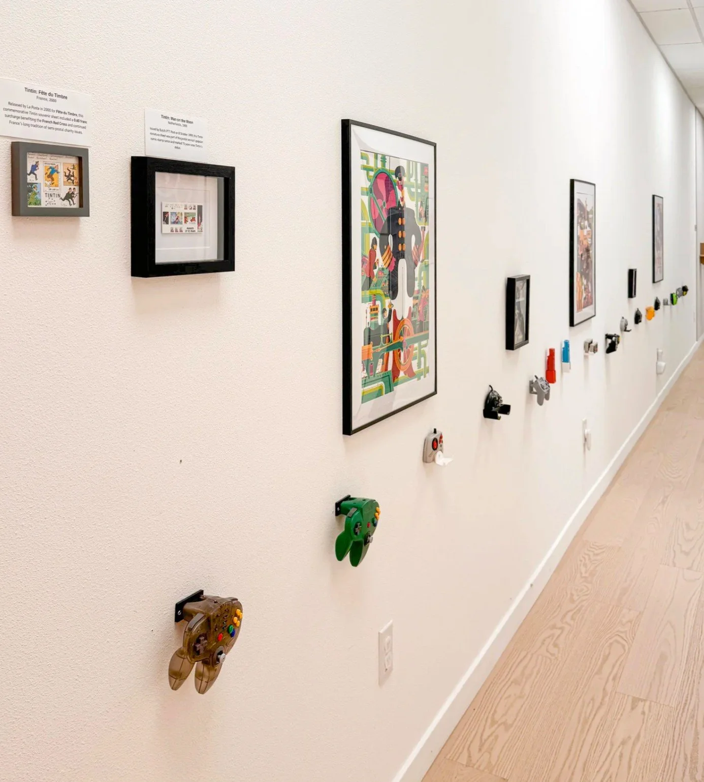 Interactive Gamepad Wall at Imagine Minds featuring modern and retro gaming controllers integrated into a custom exhibit display.