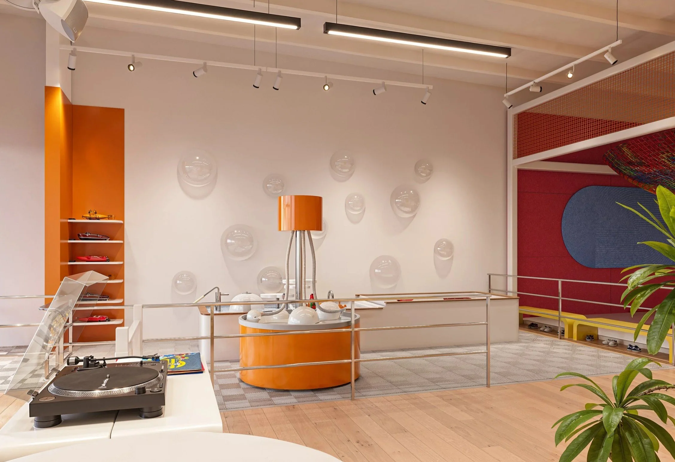 RC boat display and bubble-inspired interactive environment at Imagine Minds, featuring custom orange shelving, playful lighting, and experiential interior design.