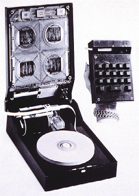 The First Handheld Calculator . (Image from Computer Desktop Encyclopedia (c) 2000 Texas Instruments, Inc.) In 1967, Texas Instruments introduced the first handheld calculator. The opened unit in the picture shows the paper tape used as output.