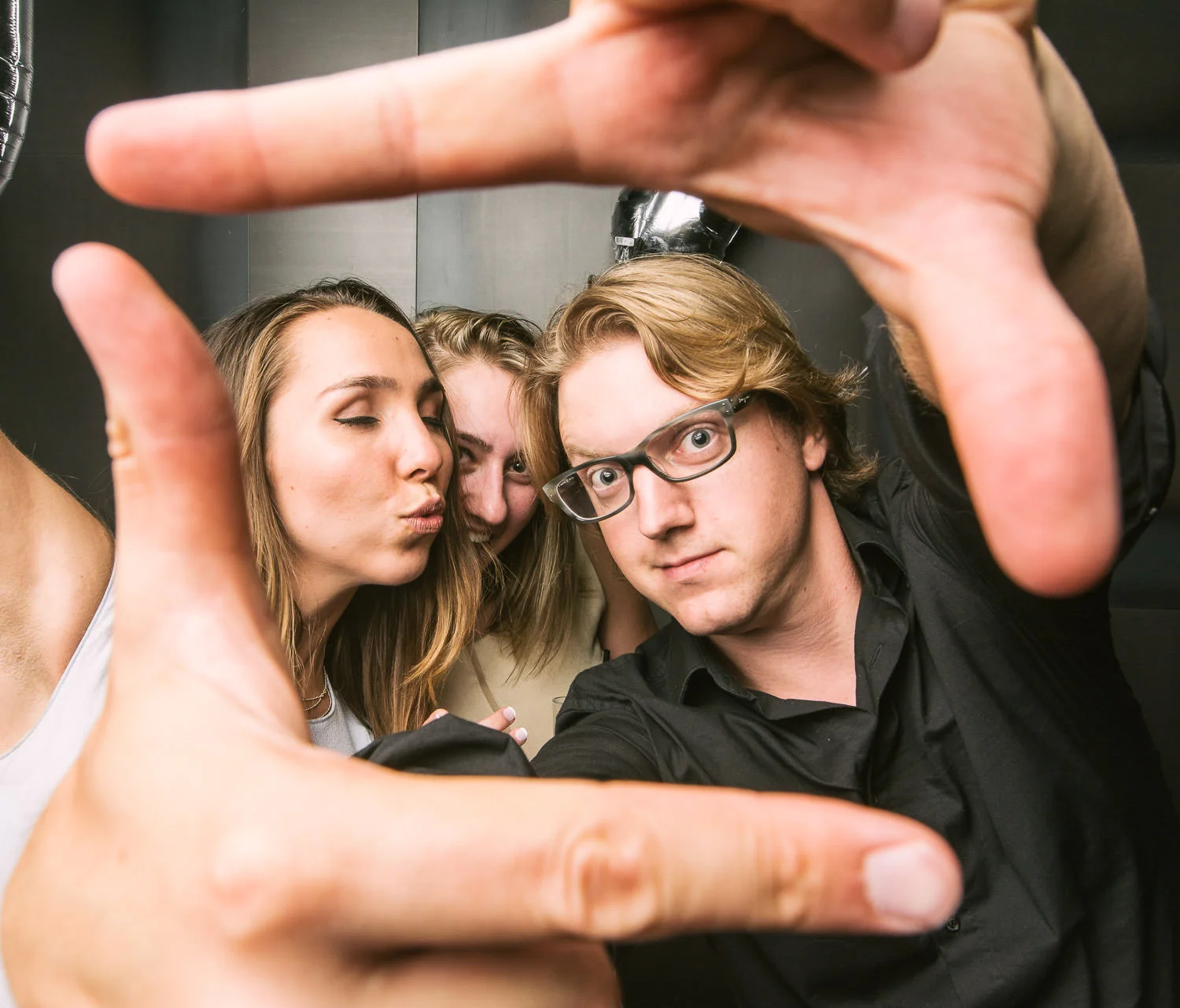 This is me.... and some wedding guests.... in a photobooth... that I set up, (yes I do that too). Not sure their names, but this is the sorta fun we have at the end of a long day :)