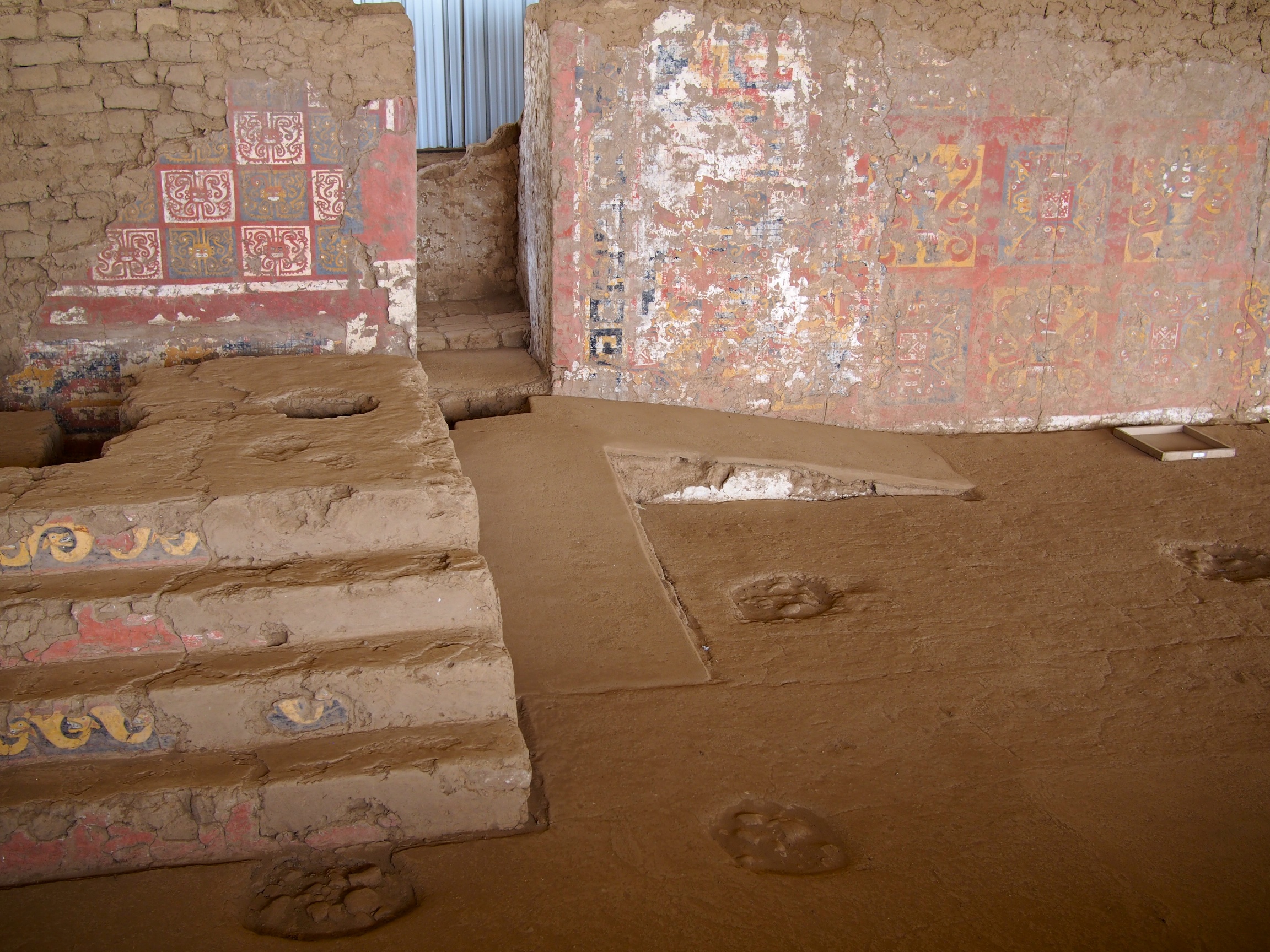 It was on this pedestal to the left that the priests would drink the blood of the human sacrifices. It was open to a courtyard below so everyone could witness the ceremony - Huaca de la Luna, Trujillo, Peru