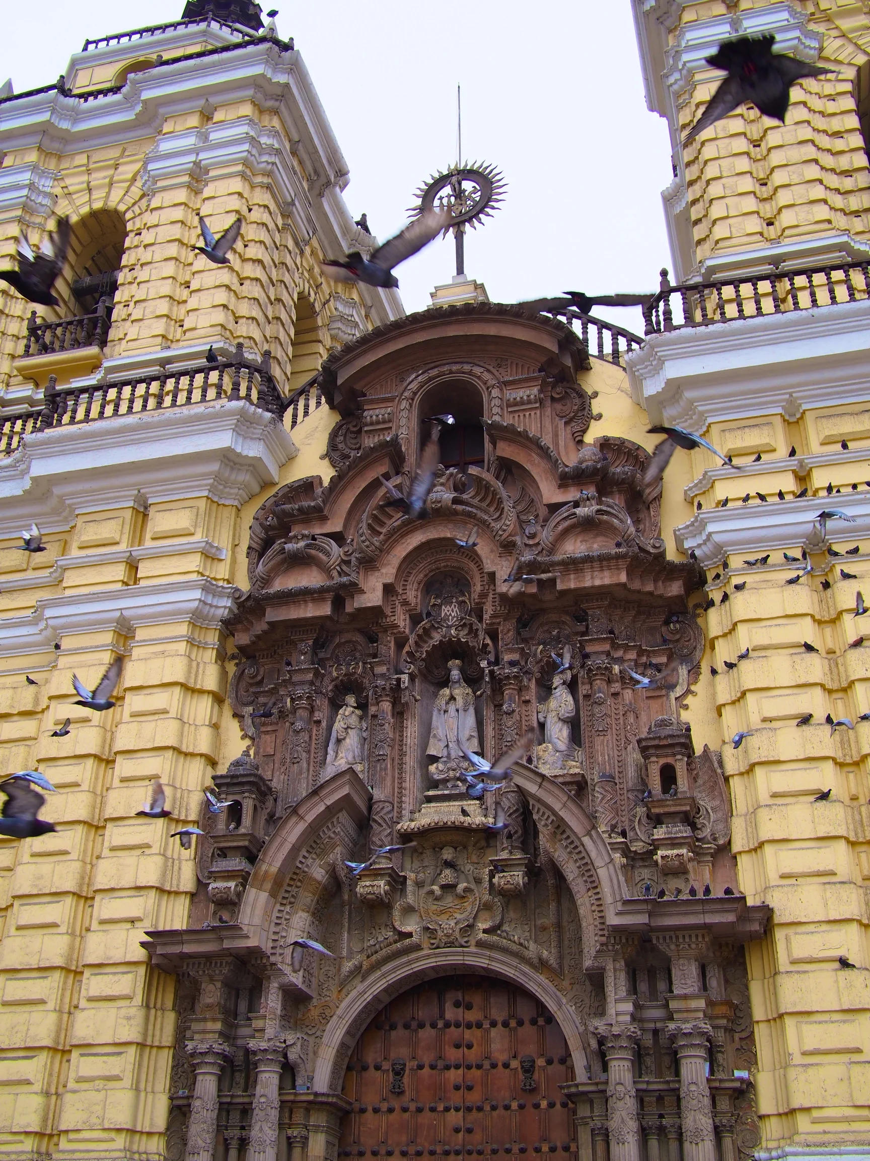 Front door of the San Francisco Monastery, complete with an insane amount of pigeons - Lima, Peru