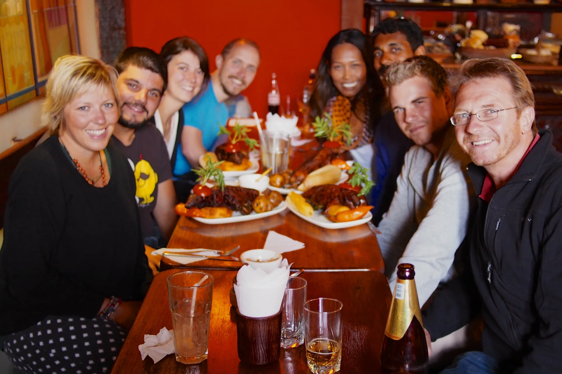 Part of our hiking group trying out cuy (guinea pig) - Cusco, Peru