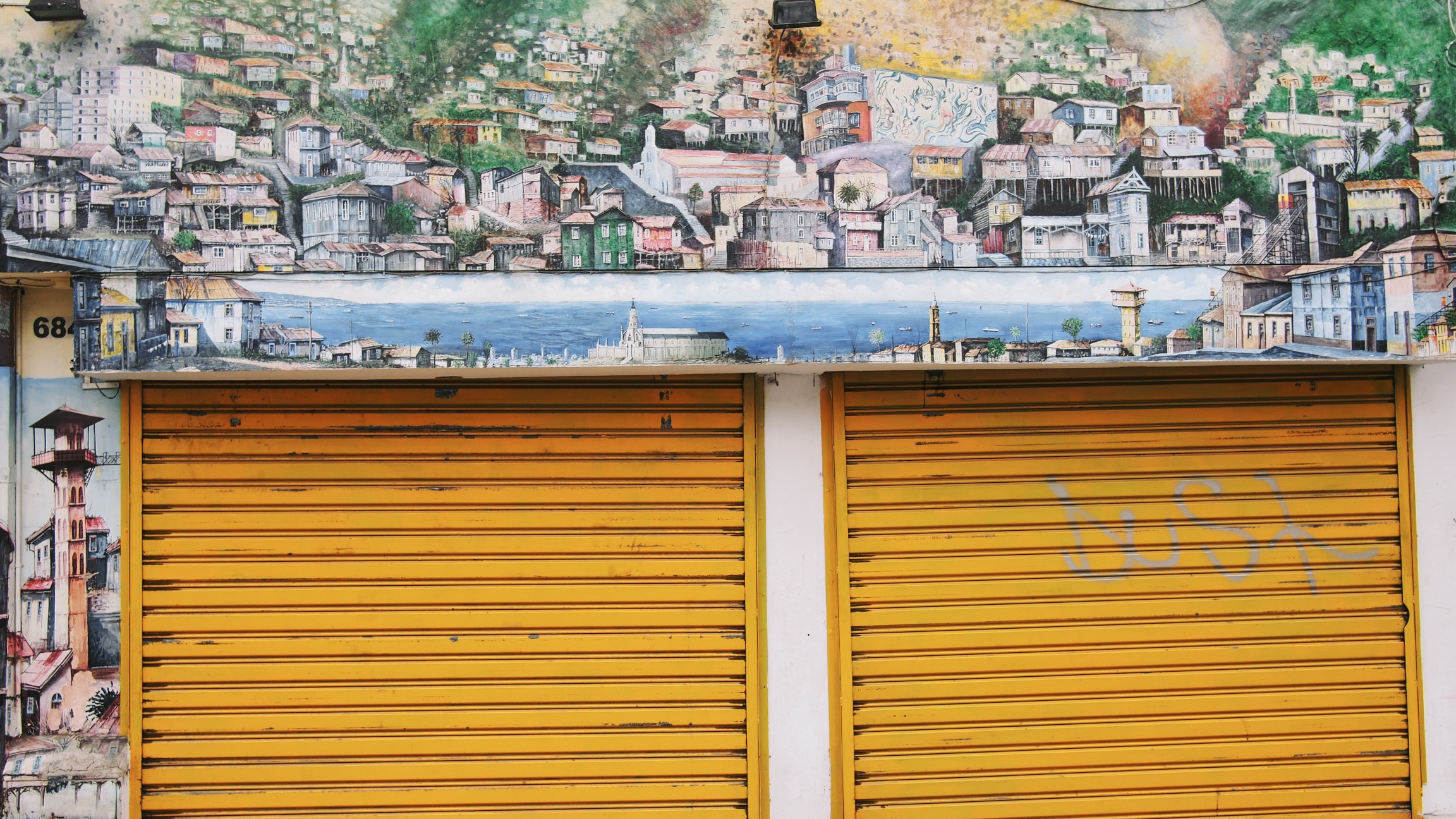 Above and below, some of the interesting artwork adorning the streets of Valparaíso
