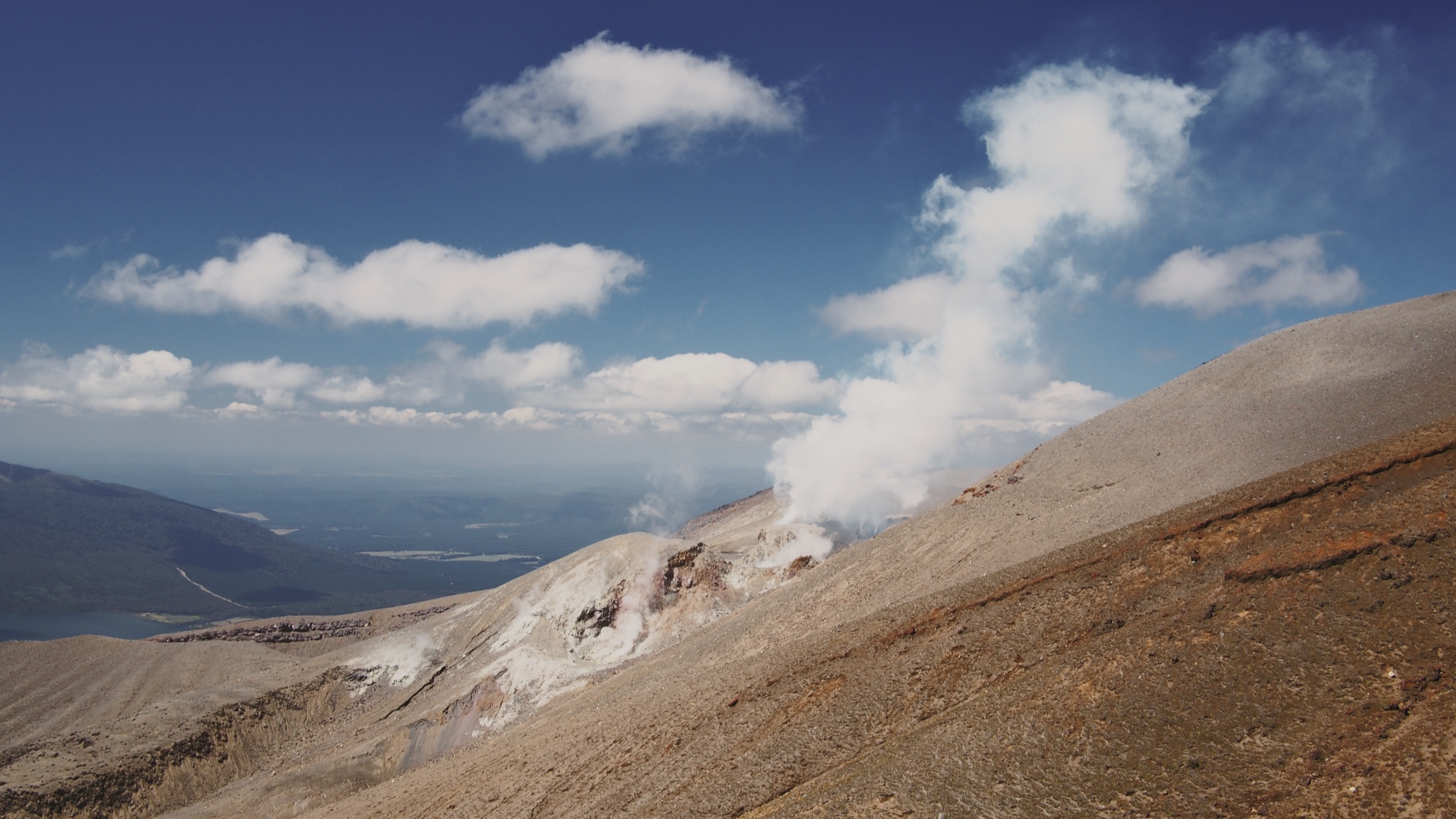 Some active steam vents on our way down. The vapor almost looked like the clouds behind it!