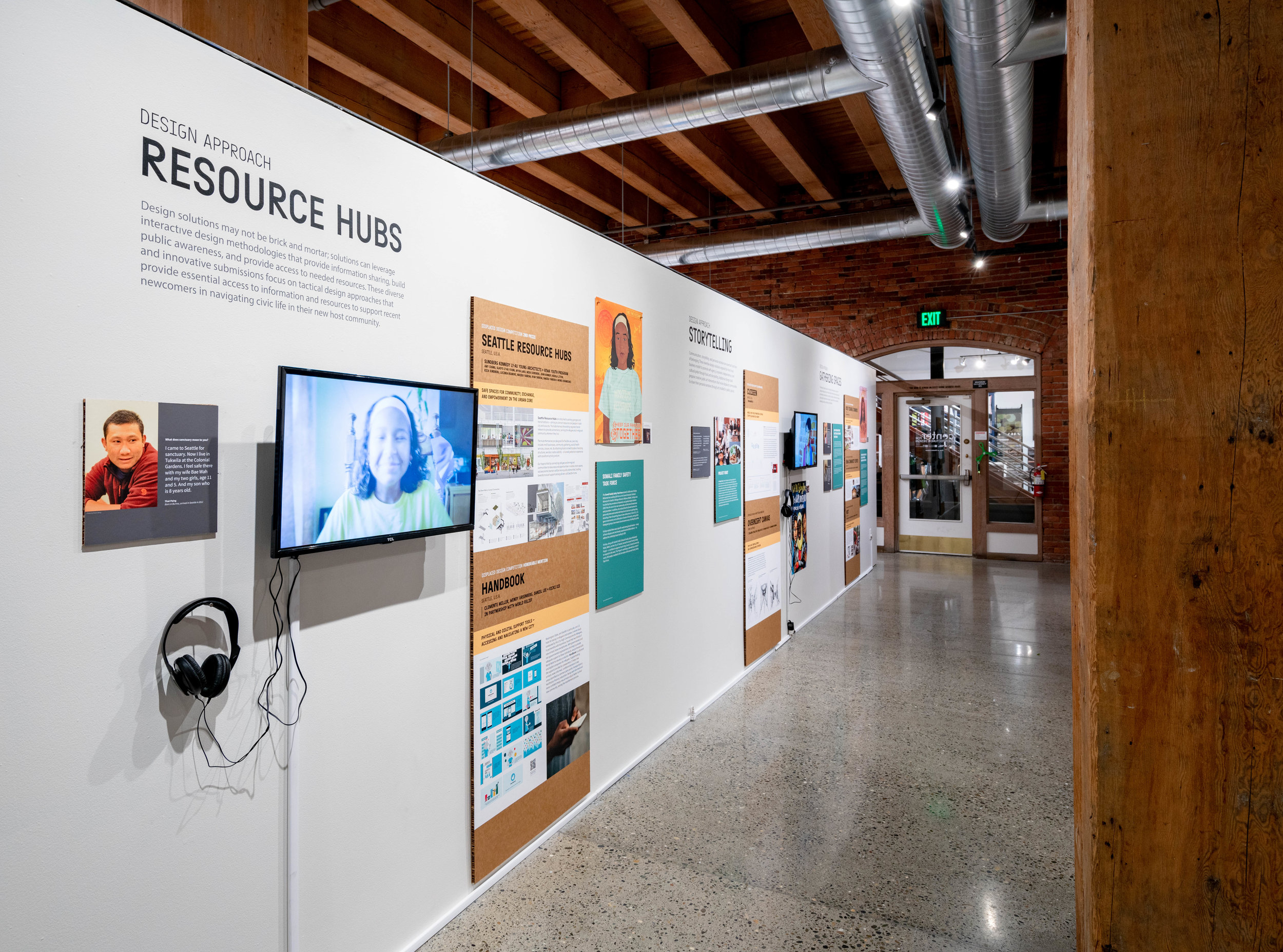 Exhibit is organized into five Focal Points (Resource Hubs, Storytelling, Social innovation, Shelter, and Gathering Spaces), clustering design solutions, artwork, video, and local stories by these themes.