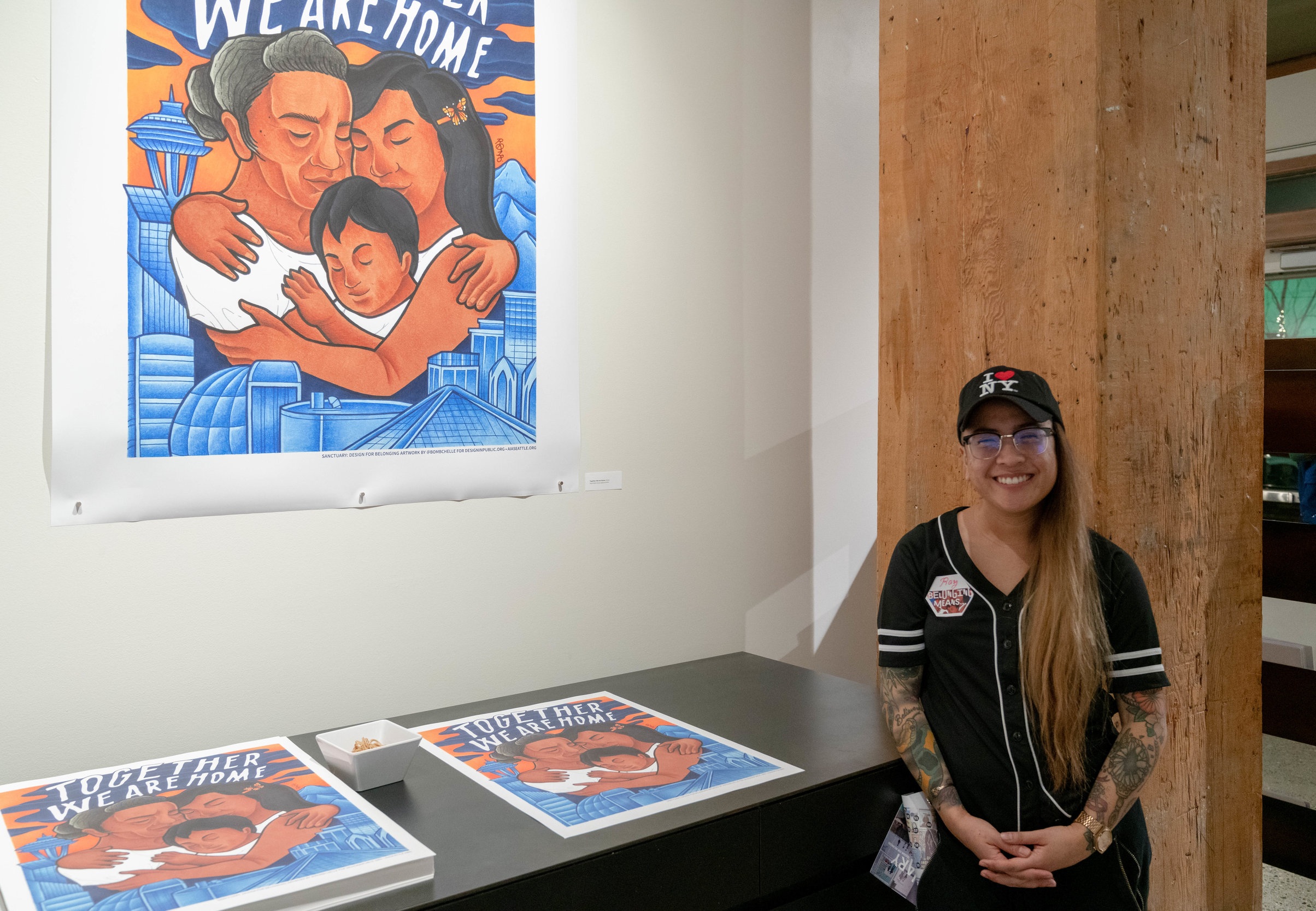 We commissioned Seattle artist Raychelle Duazo to illustrate a poster and message visitors could take home with them: “Together We Are Home”.