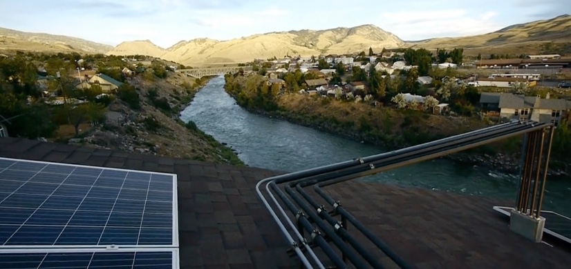 I climbed on rooftops, including this one in Gardiner, Mont., while producing content in support of alternative energy development.