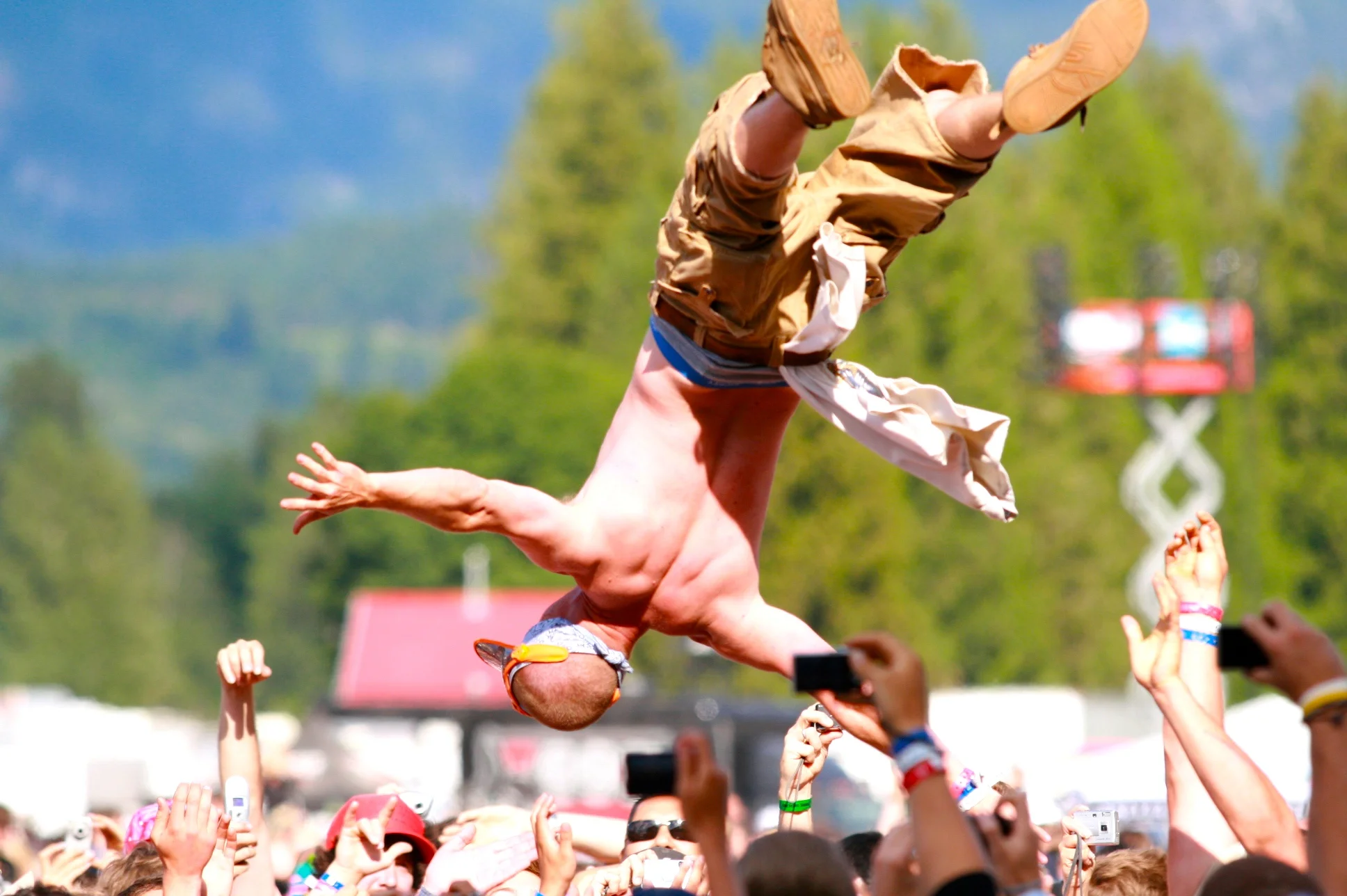 A concert-goer gets tossed in the air during the inaugural Pemberton Festival.