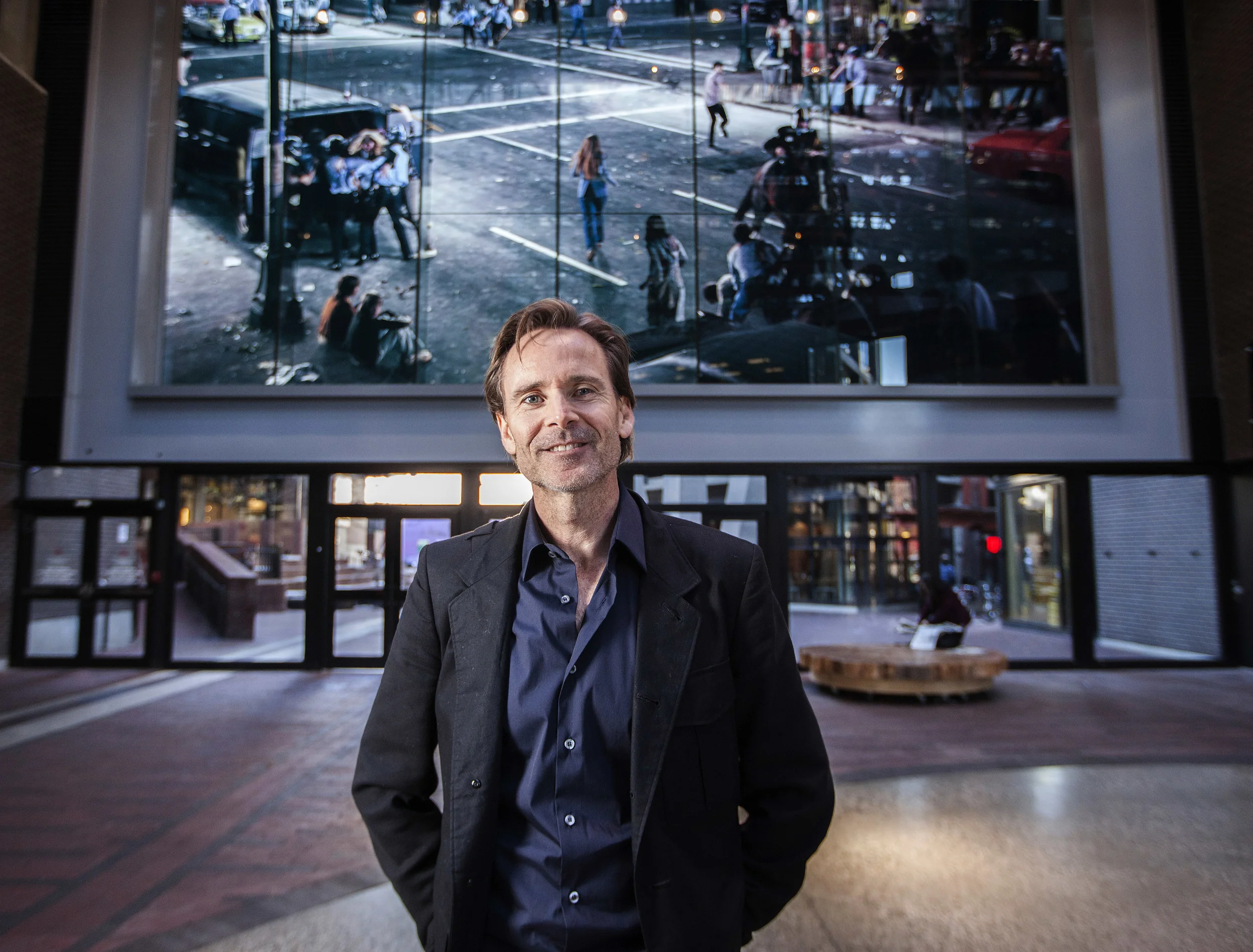 City developer Ian Gillespie standing in the Woodward's atrium, Nov.19, 2015. Gillespie is supplying 12 furnished apartments in downtown Vancouver for four to five months as transitional housing for Syrian refugees as they wait for permanent housing.