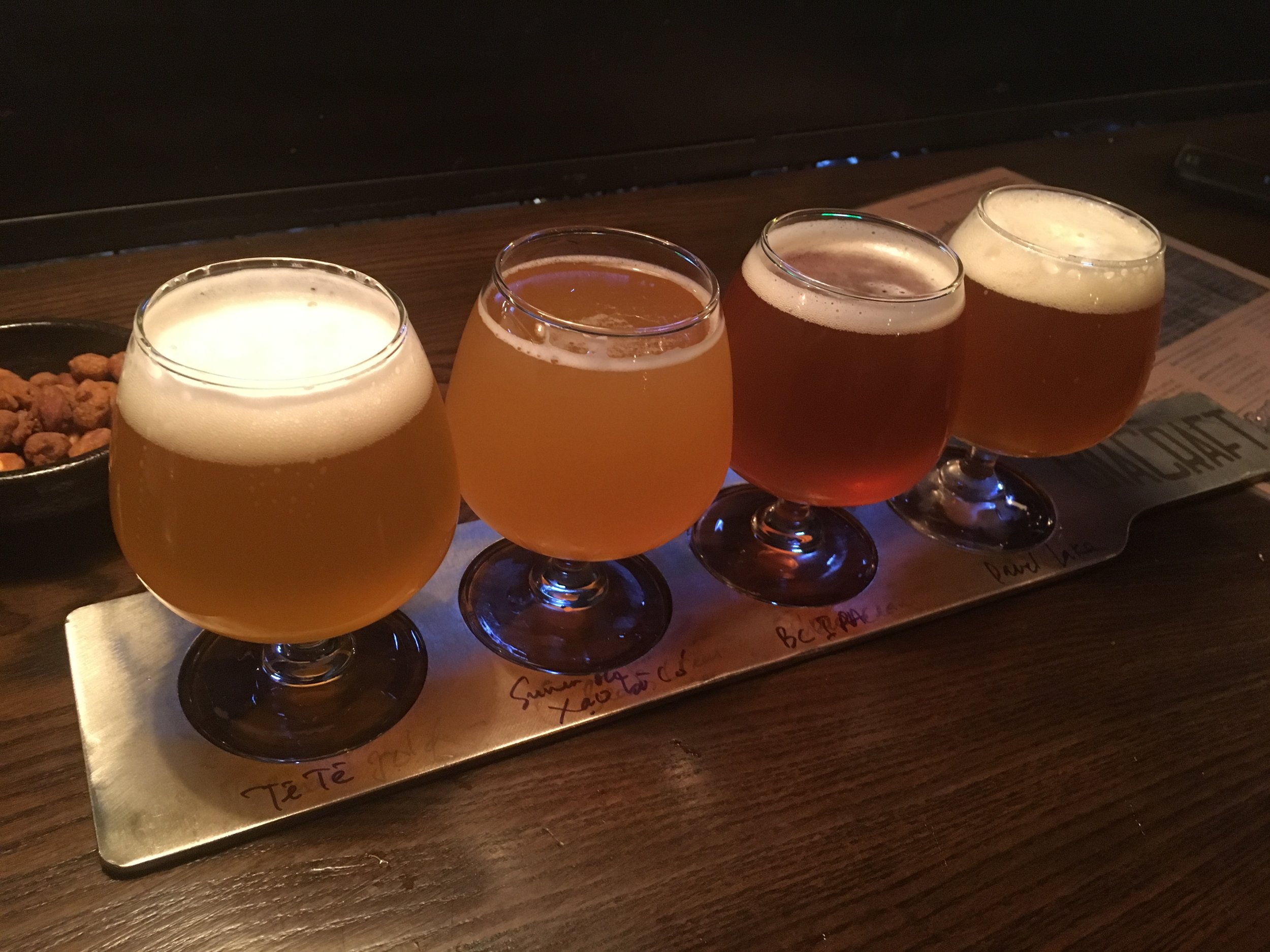Our first tasting flight: Tê Tê Belgian Wheat, BiaCraft’s Xao Ba Co India Summer Ale, BiaCraft's Xau Ma Chanh IPA, Lac Brewing Co.'s Devil's Lake IPA