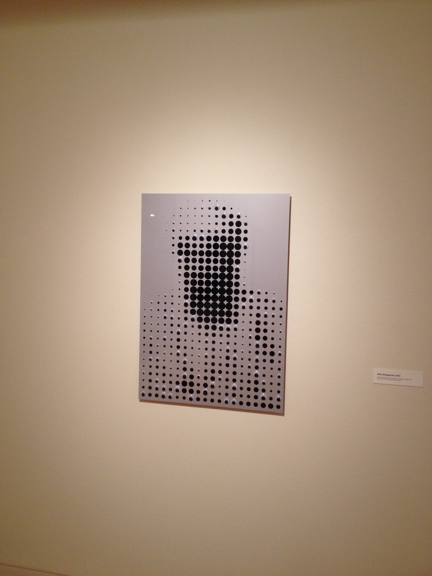 "The Boogeyman" by Douglas Coupland. Hold your cellphone camera up to the screen if you can not make out the image.
