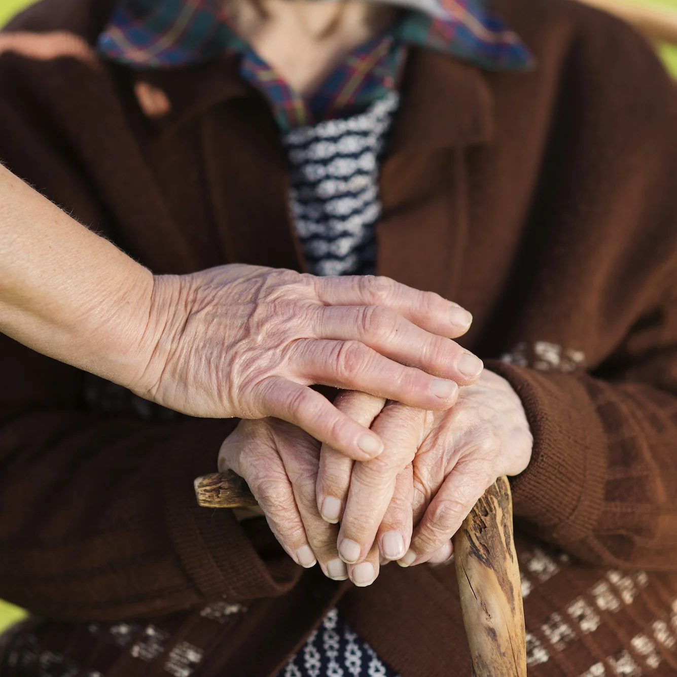 graphicstock-closeup-of-caring-woman-holding-female-seniors-hands_HAdOpB2-W.jpg