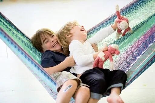 laughing boys swinging .jpeg