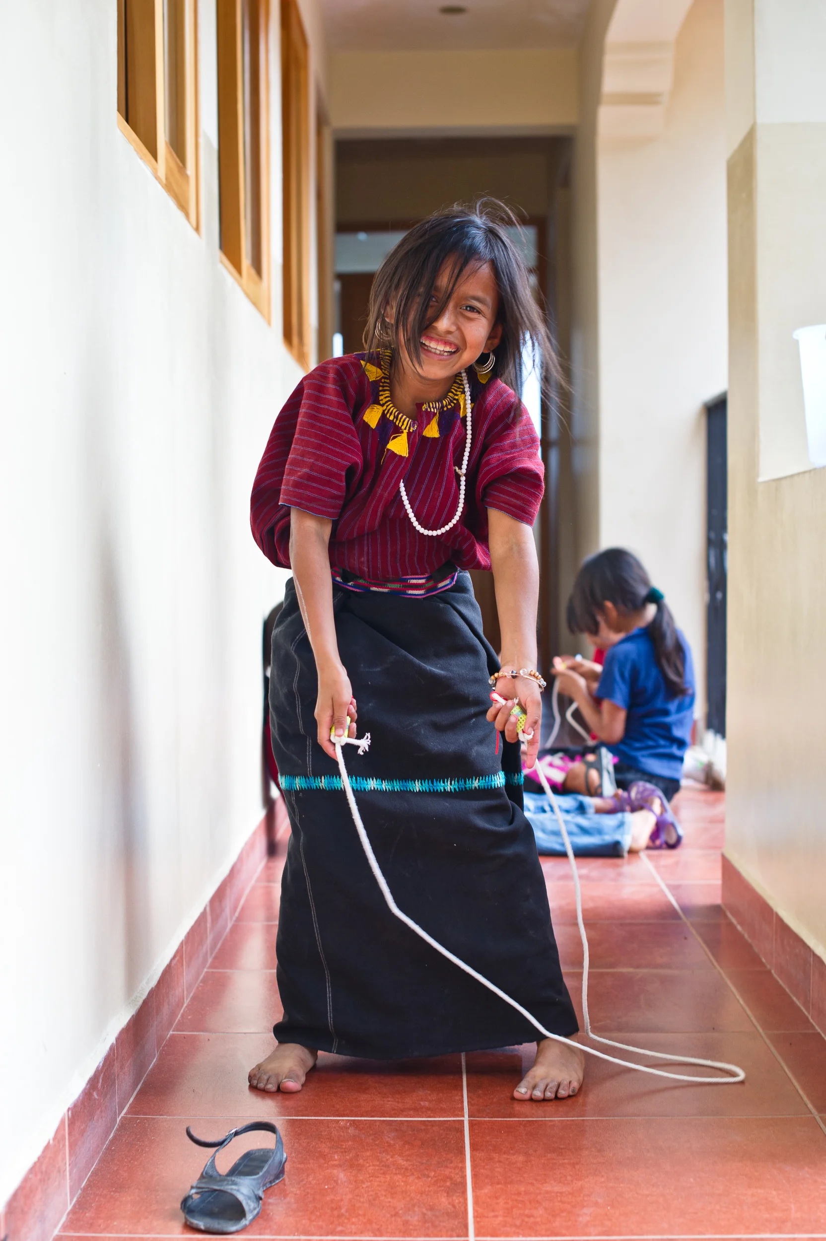 The craft projects are built around materials that are easily found in the pueblo. Items like rope, empty snack bags and discarded bottle caps become jump ropes and art materials.