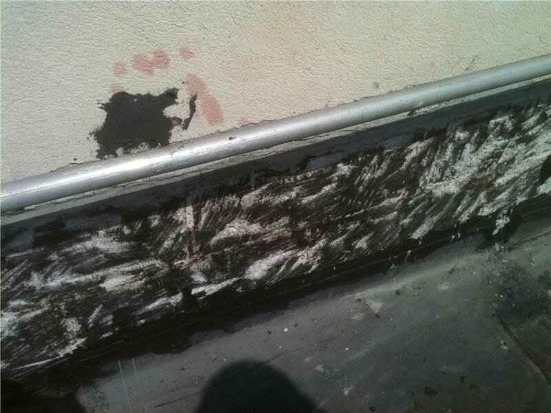 A white residue on aged asphalt-based roofing materials may indicate the presence of asbestos.