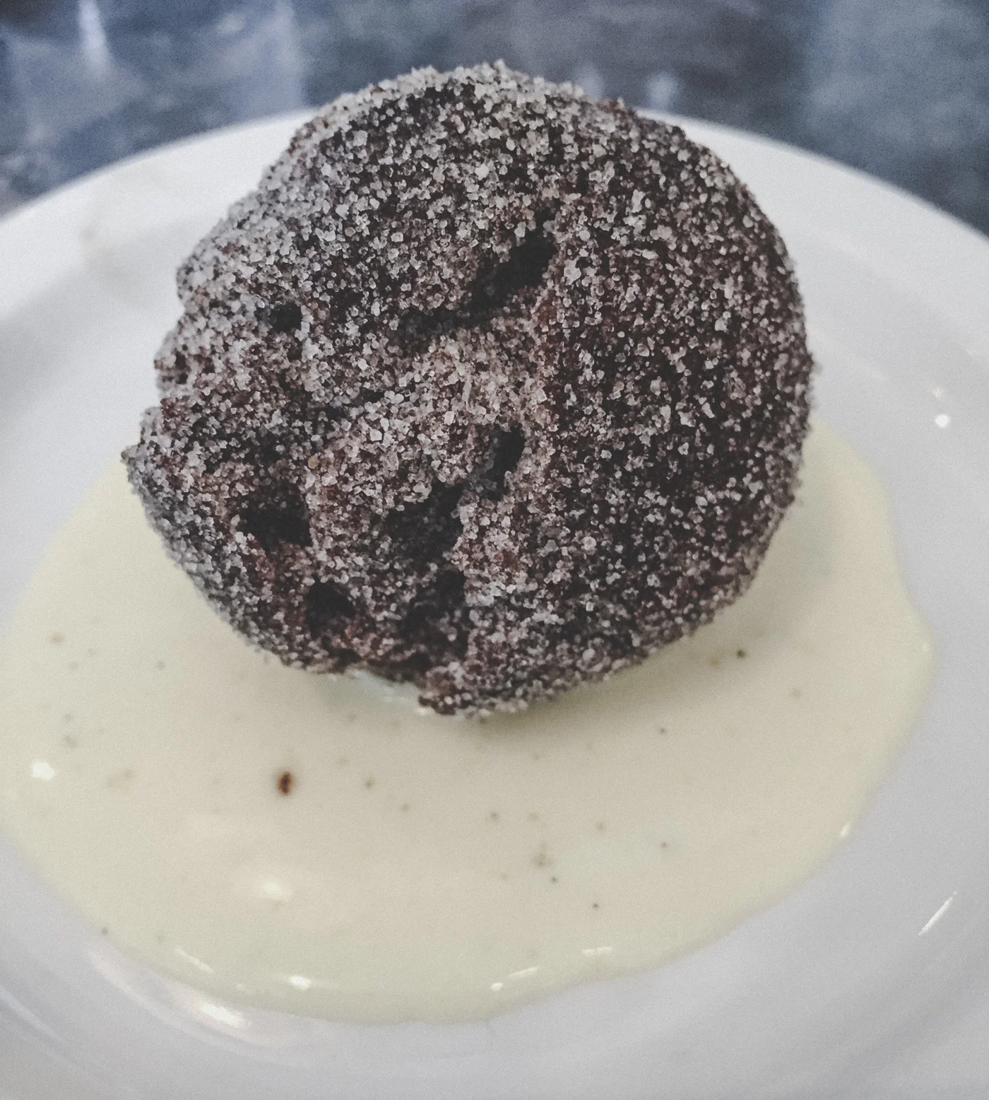 Chocolate potato doughnut with creme anglaise at Tasty n Sons .