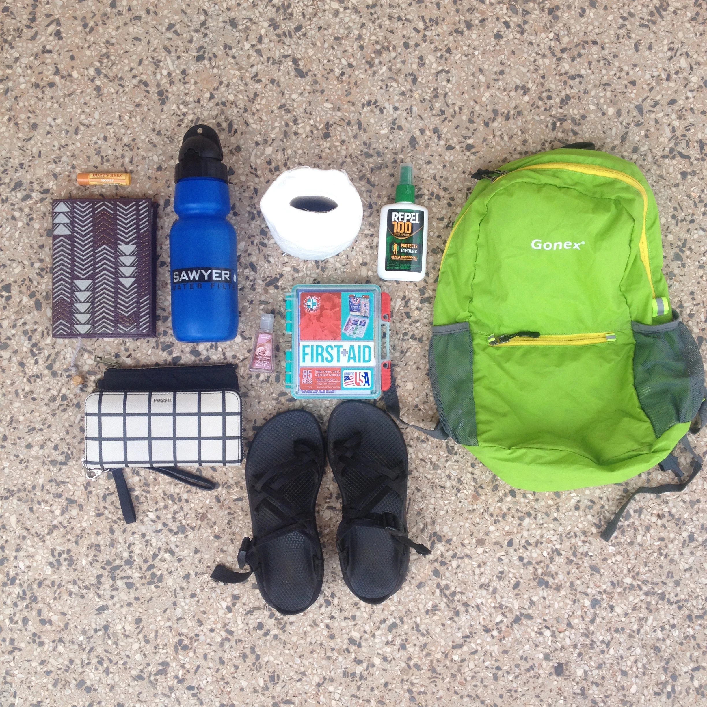 The everyday supplies for Ghana. Most notably my journal, Burt's Bee's chapstick, and some handy Chacos for the market.