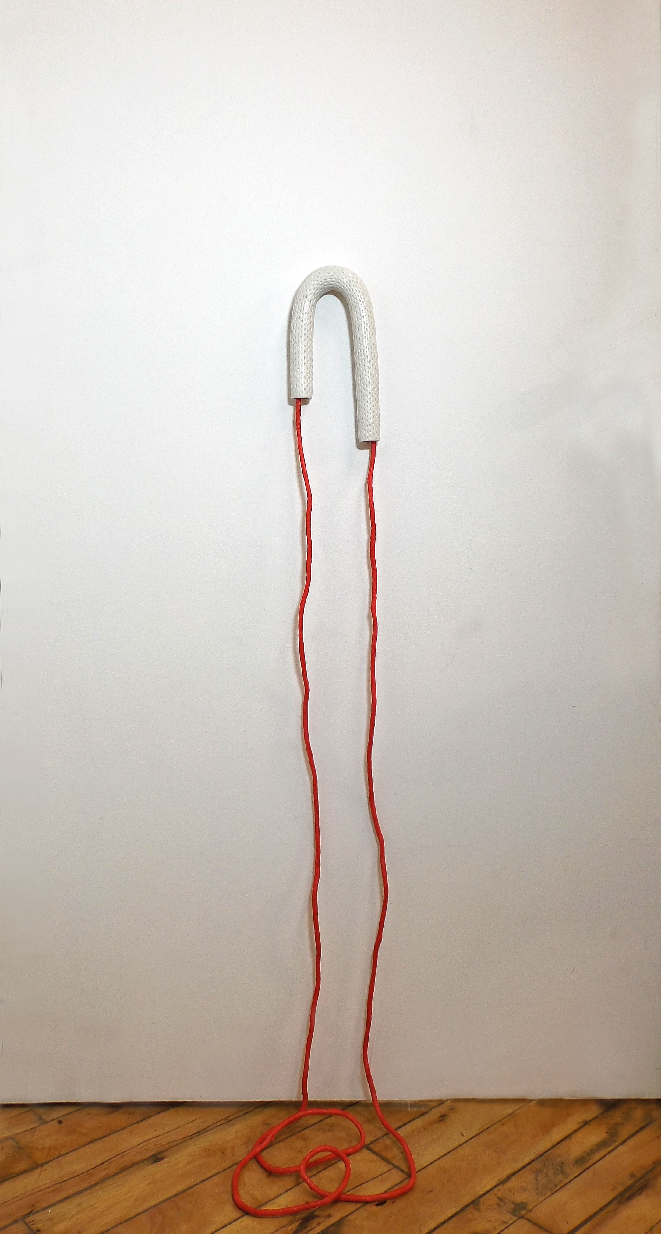 STEPHANIE FLOWERS Upend , 2014. Porcelain, rope, wax, pigment, 52 x 5 x 1.5 inches.