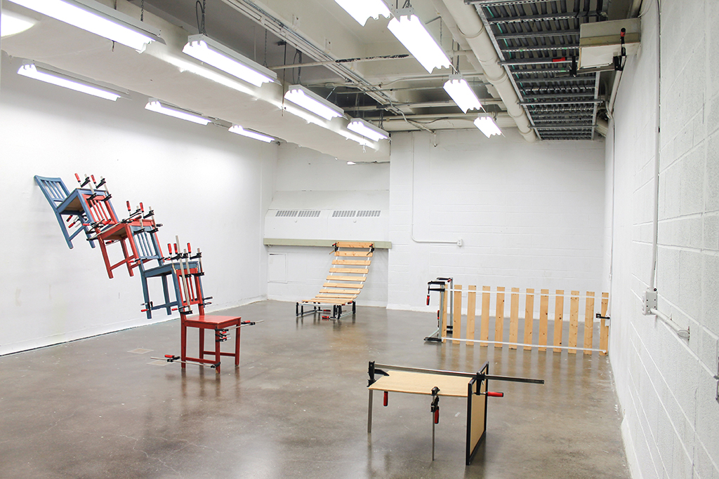 Grounders , 2017 Installation view Bar clamps on discarded objects
