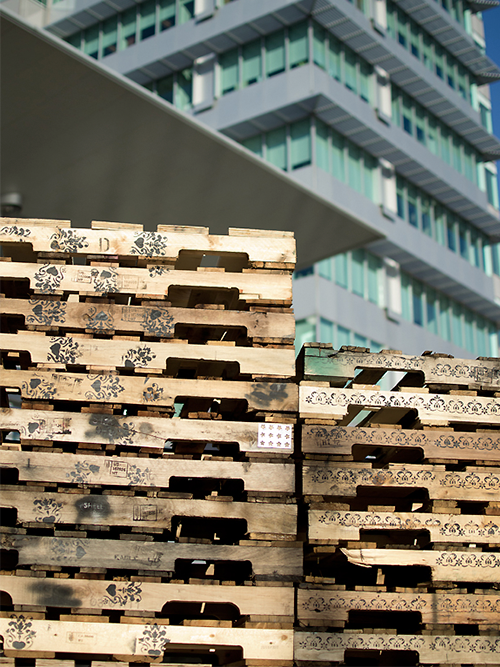   Cultured Pallets: KW , 2011 Stencilled recycled wooden pallets 60’ x 10’x 40” (approx.) 