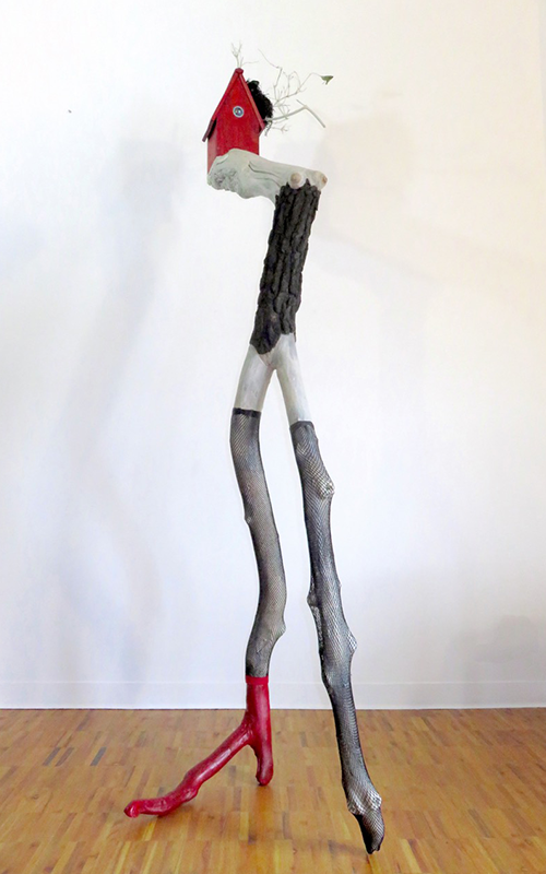   The Fascinator,  2015 Tree limbs, wood house, LED light, glass, bird’s nest, nylon stockings, acrylic paints, wood stain 96" x 30" x 32" 