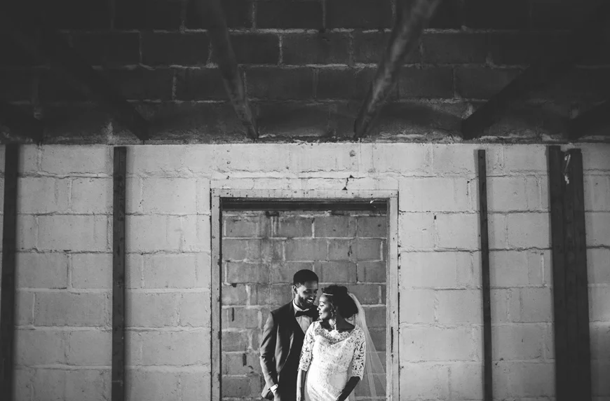 012 bride and groom portrait in broken down house.jpg
