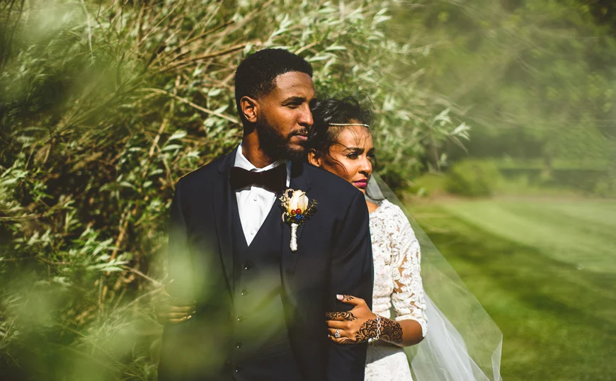 011 bride and groom look off into distance in greenery.jpg