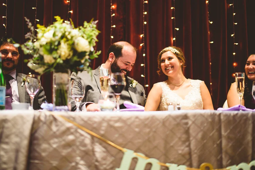 012 bride and groom laughing during toasts.jpg
