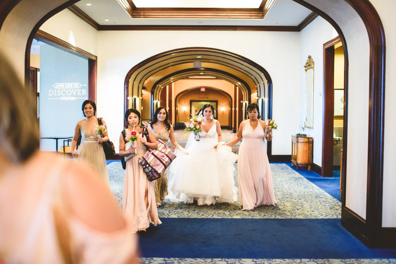 009 bride walking through a large hall on her way to wedding.jpg
