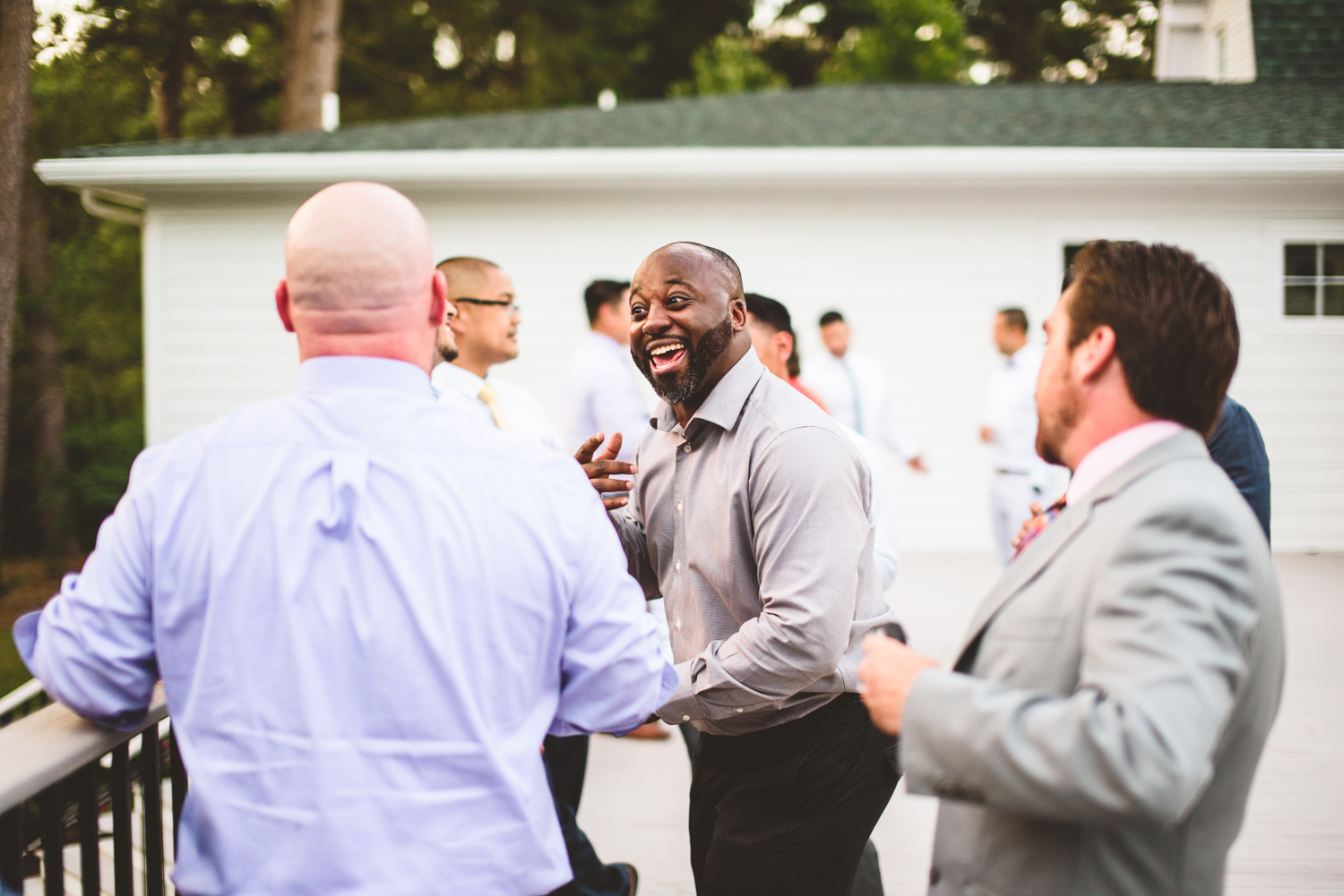 043 wedding guests laughing together.jpg