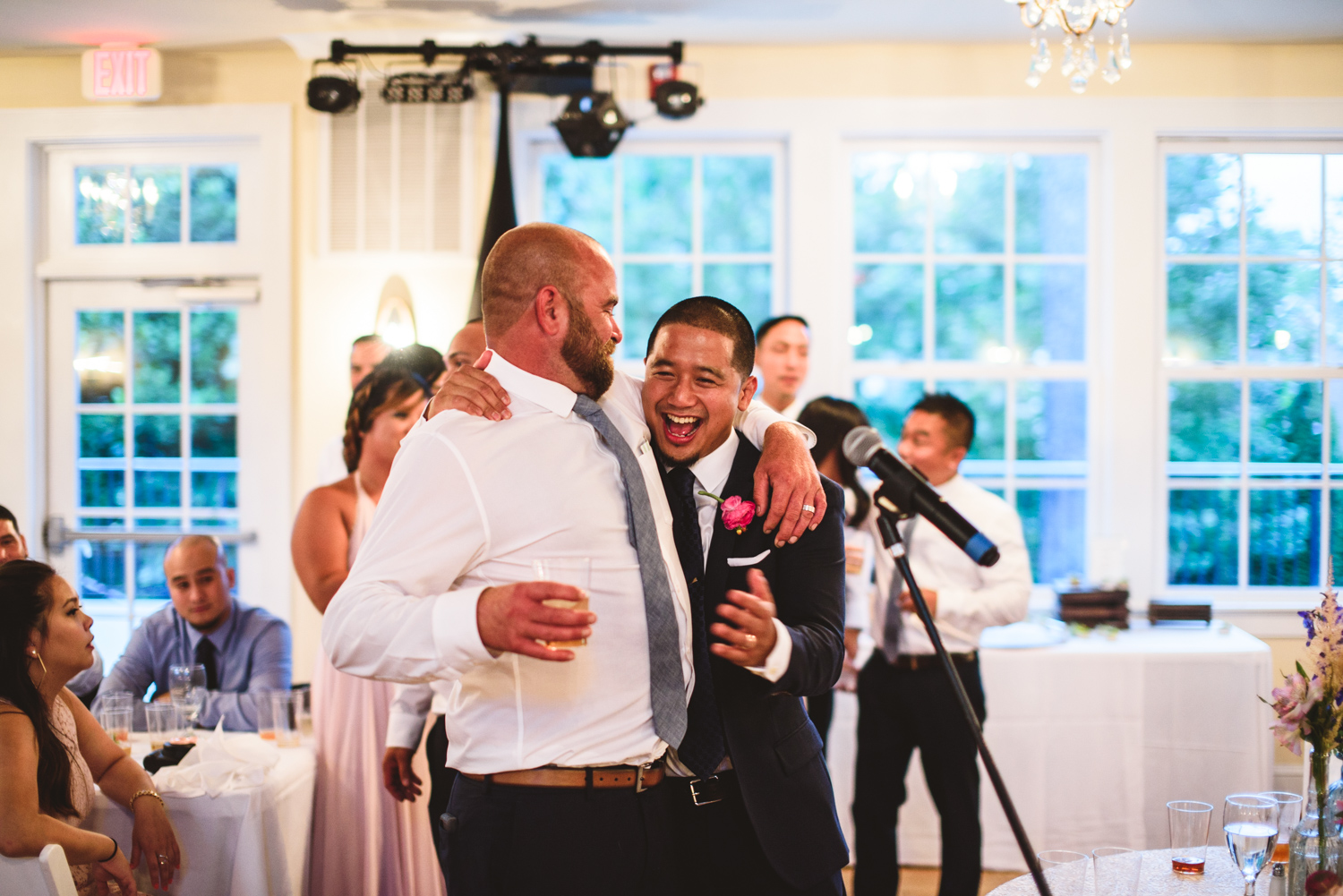 046 groom laughs with groomsman.jpg