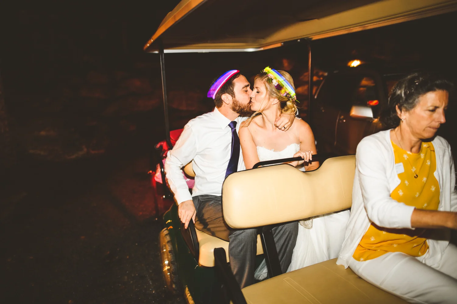 038 - bride and groom exit wedding in a golf cart.jpg