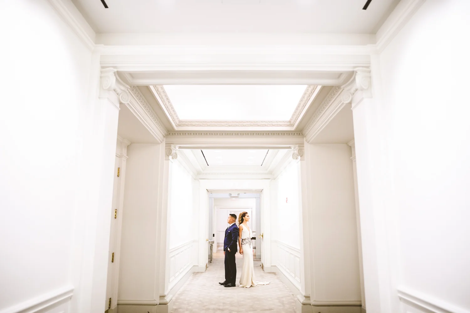 006 - wide engagement portrait in hotel hallway.jpg