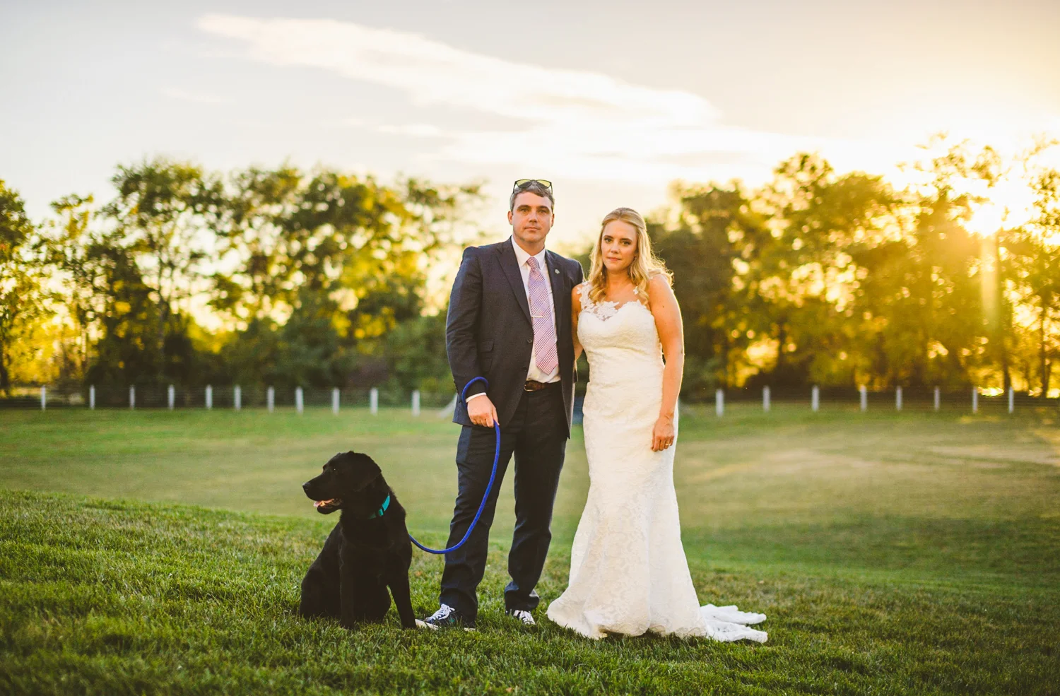 011 - the bride and groom and their dog pose for a wedding photo.jpg
