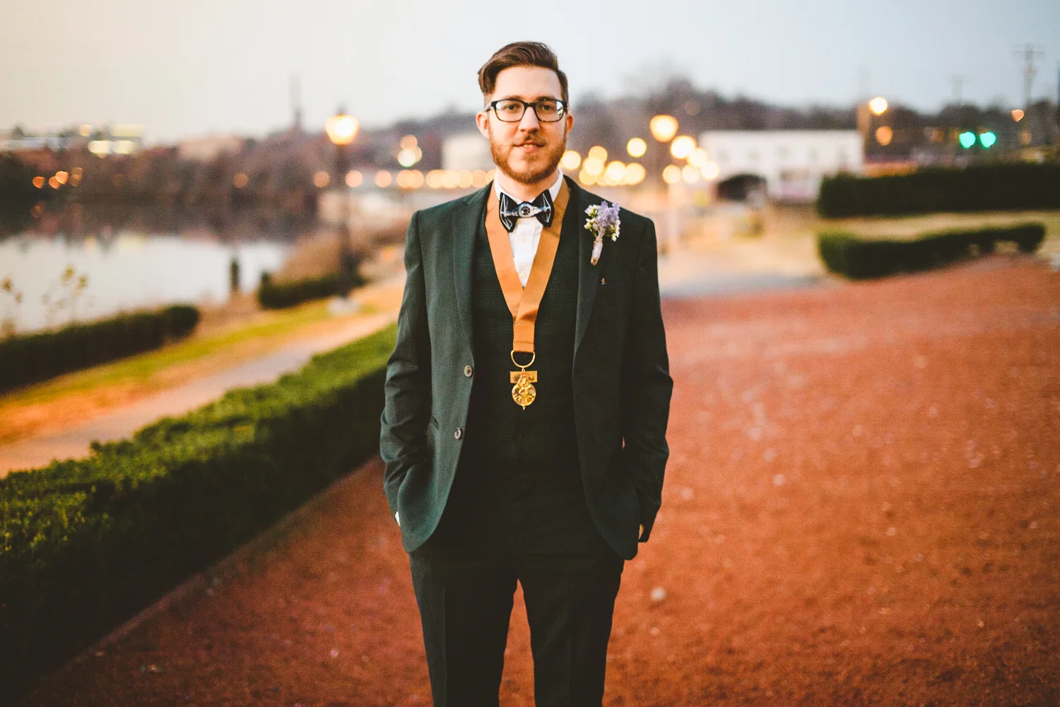 026 - groom poses for portrait at rocketts landing in richmond virginia.jpg