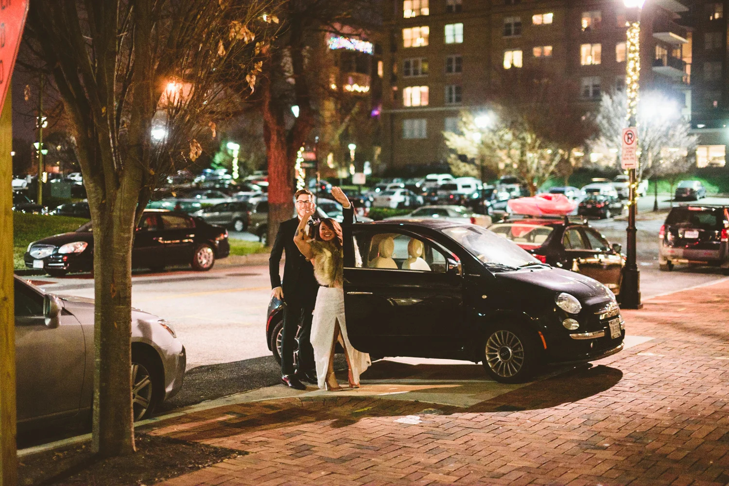 048 - bride and groom wave from their car as they exit their wedding in richmond wedding photographer nathan mitchell.jpg