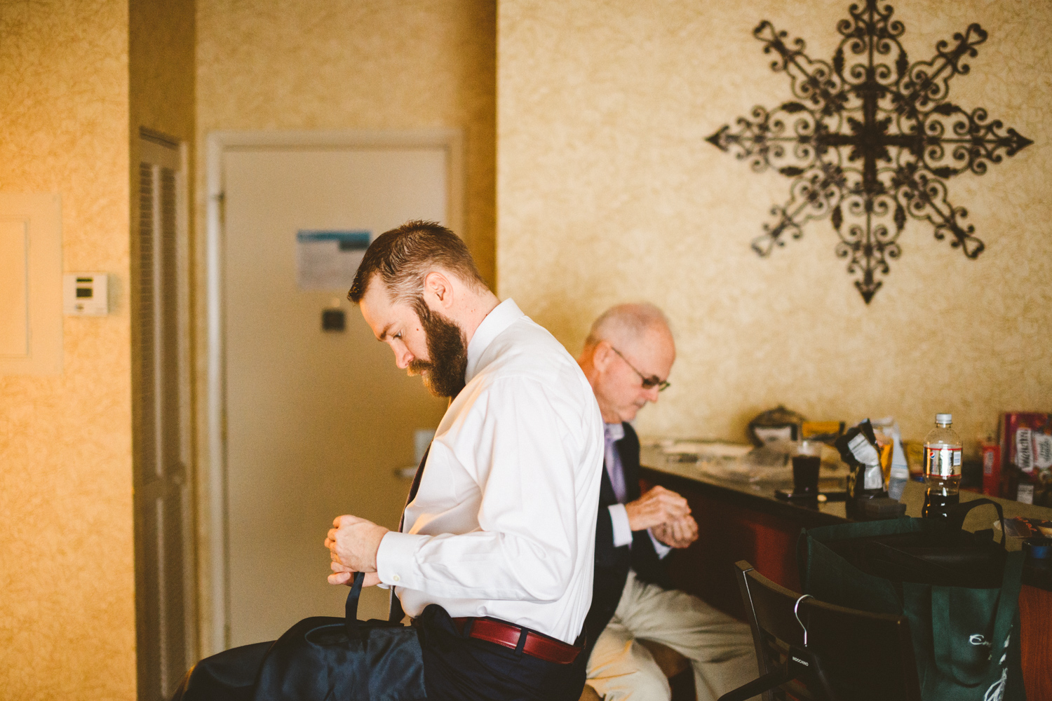 010 - groom and groom's father getting ready in groom's suite.jpg