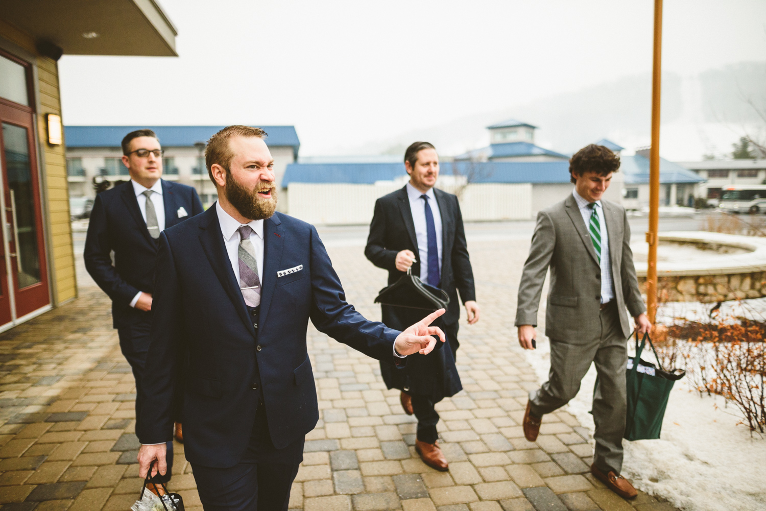015 - groom being funny as he walks with his groomsmen.jpg