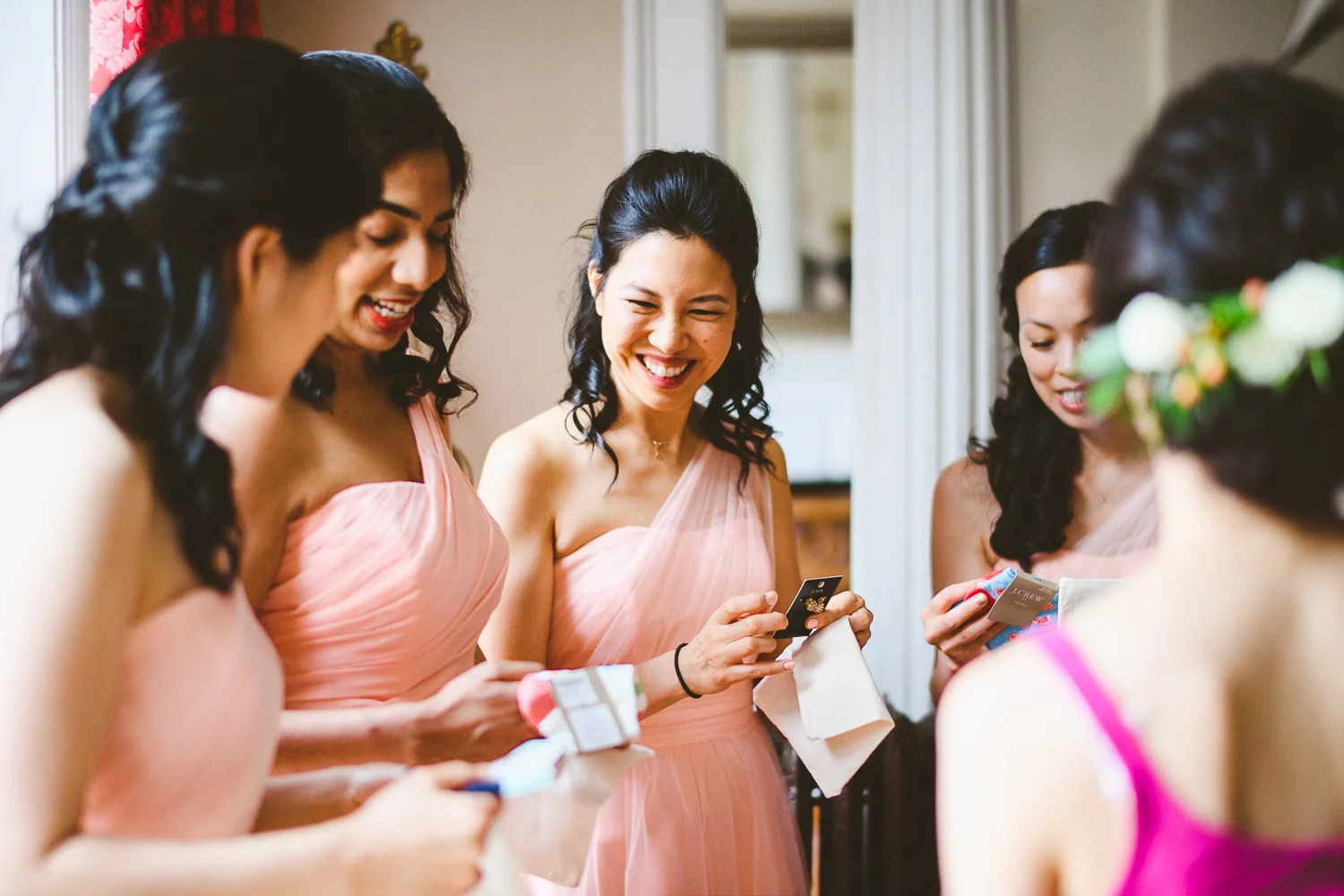 004 - bridesmaids opening their gifts from the bride.jpg