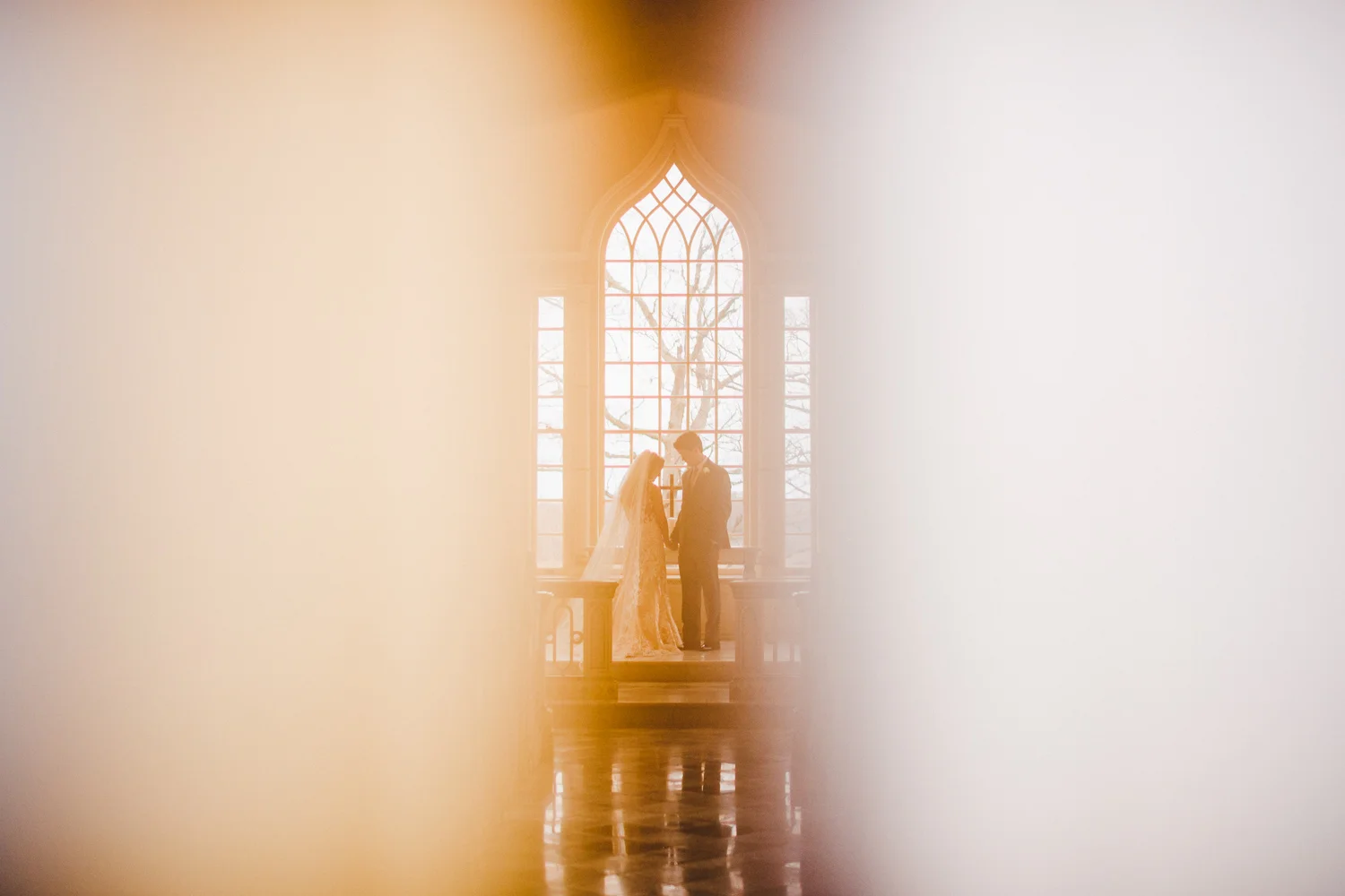 016 - awesome portrait of bride and groom in chapel.jpg