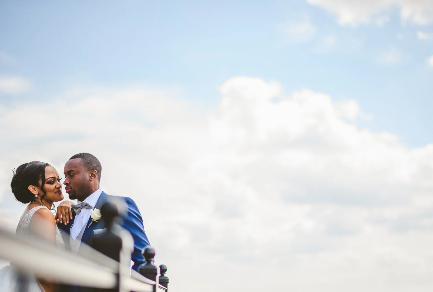 072 - african american couple portrait against gorgeous blue sky and clouds.jpg