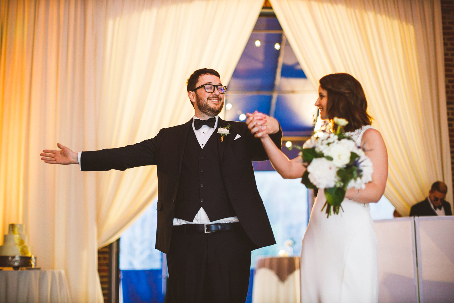 041 - bride and groom make their entrance to the reception in baltimore inner harbor.jpg