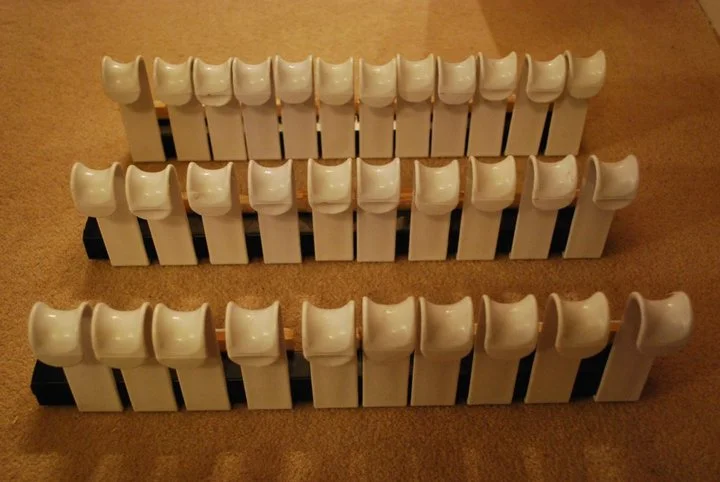 A way to attach the screen to the frame. These are those coathook things that you hang on the back of doors.