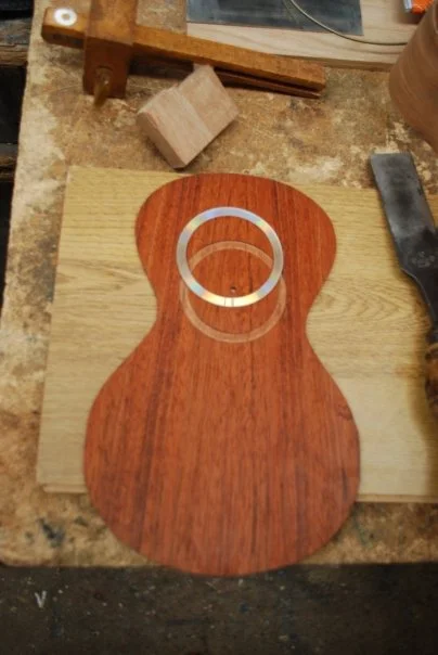 This is called ‘purfling’ which is a narrow decorative edge inlay. Usually mother of pearl or abalone, but in this case we used the reverse side of a CD. I want it to be ‘Now That’s What I Call Ukuleling’ but I’m pretty sure it was just a blank data disc. We must have used the lathe for the inlay, a router would have been too crude.