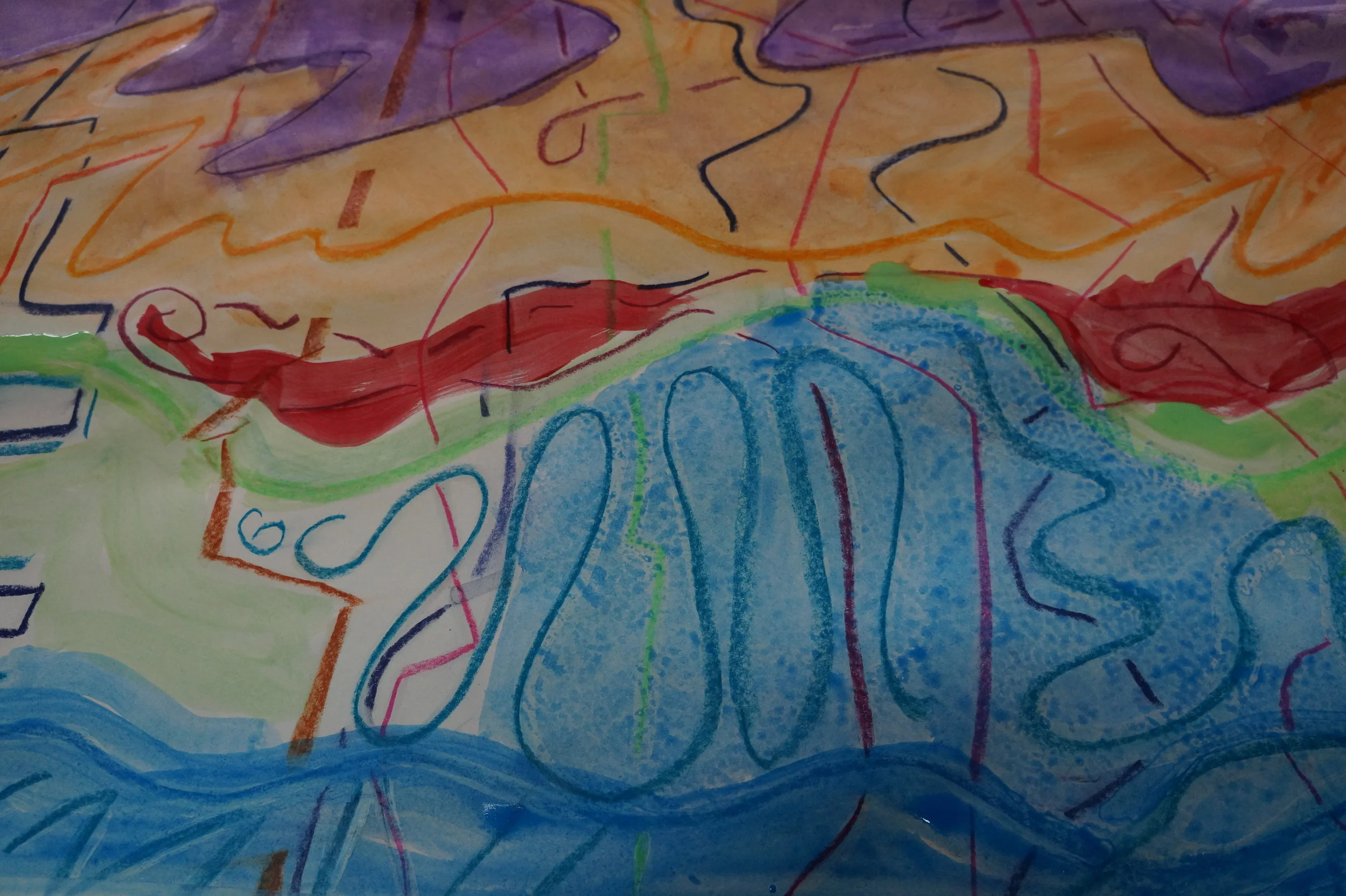 College drawing worked on in paint by a group at the hospital.